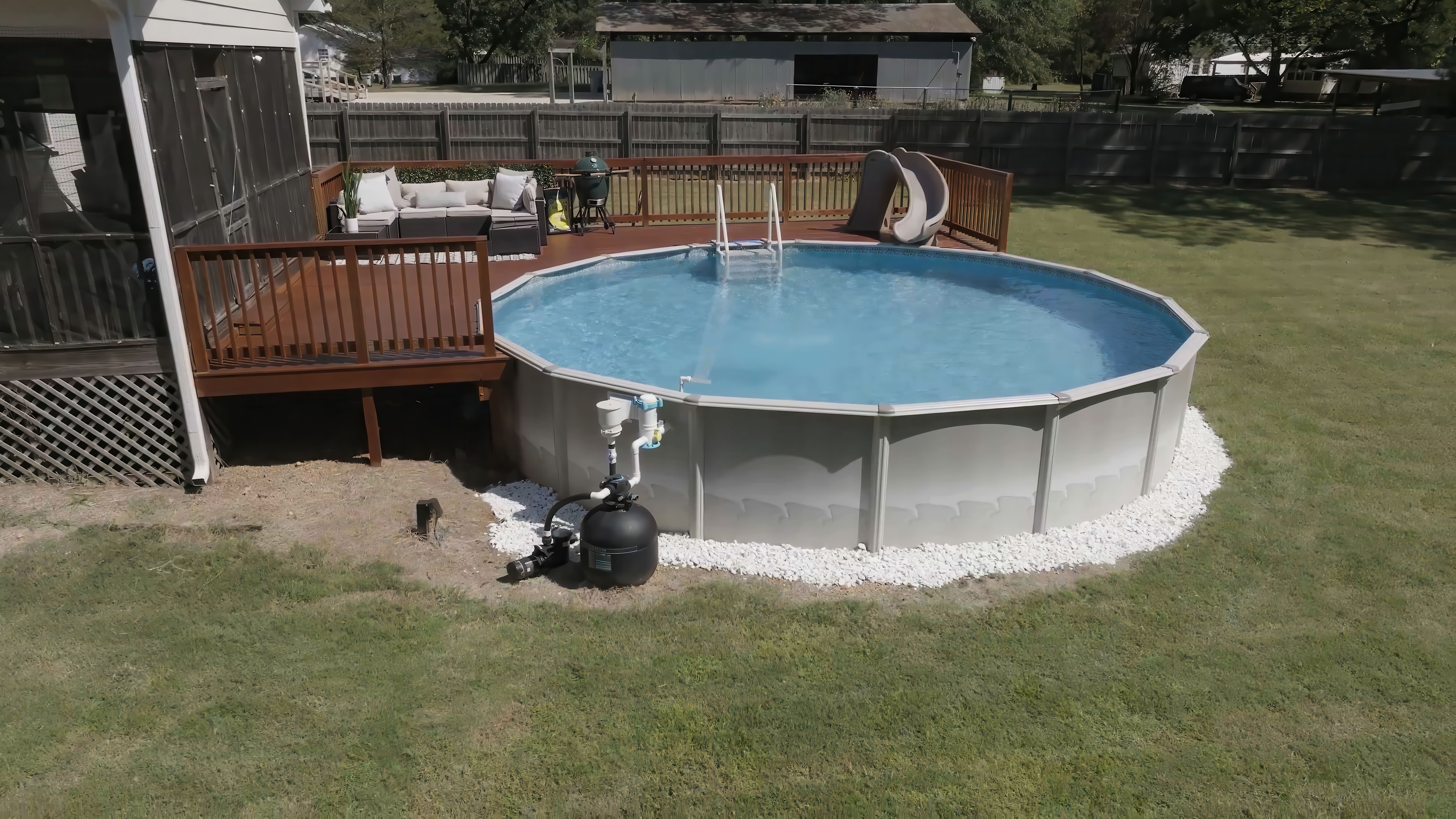Above ground pool with deck in Birmingham AL backyard